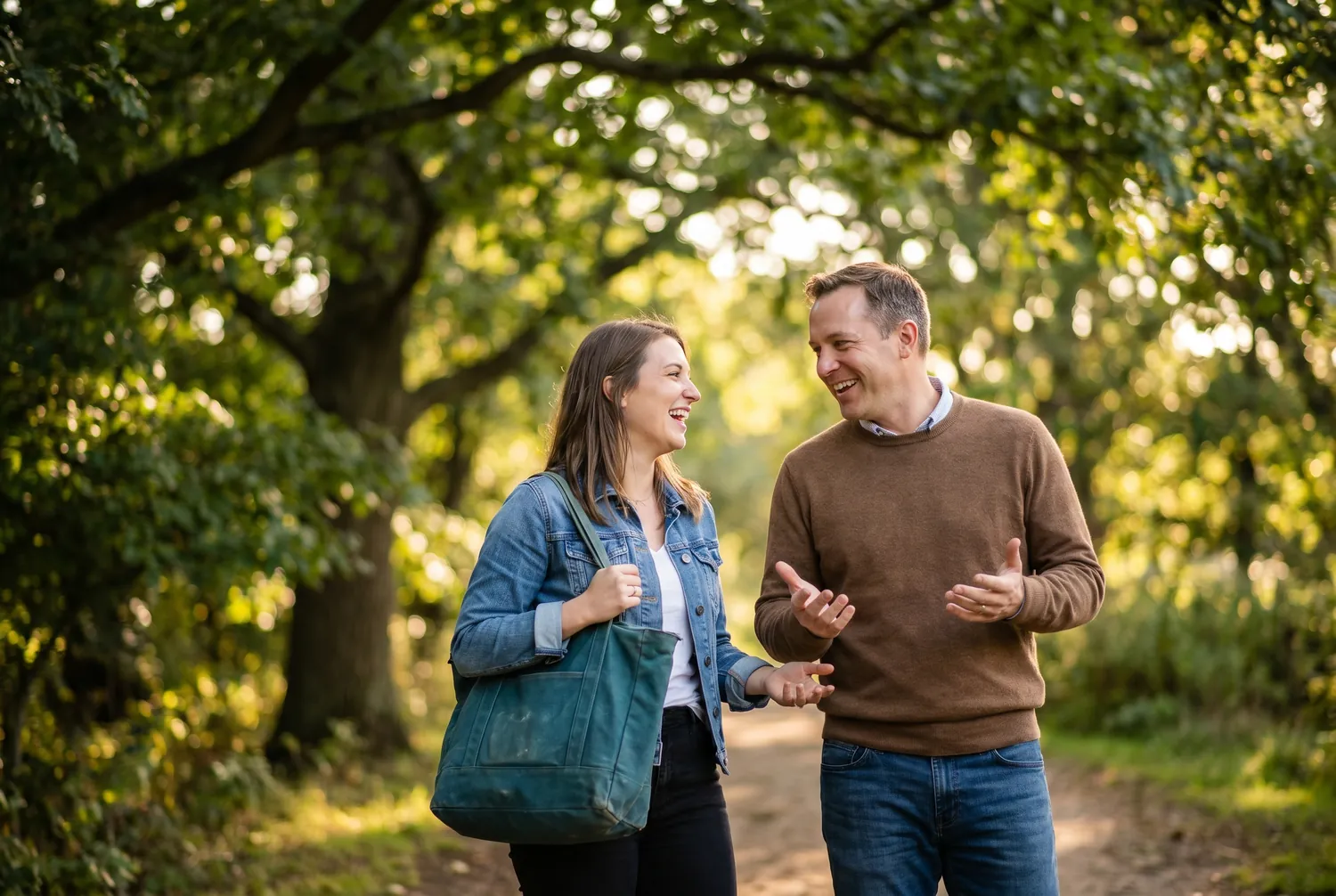 Two adults walking and talking on a park path, reflecting the collaborative way mental health treatment decisions are made
