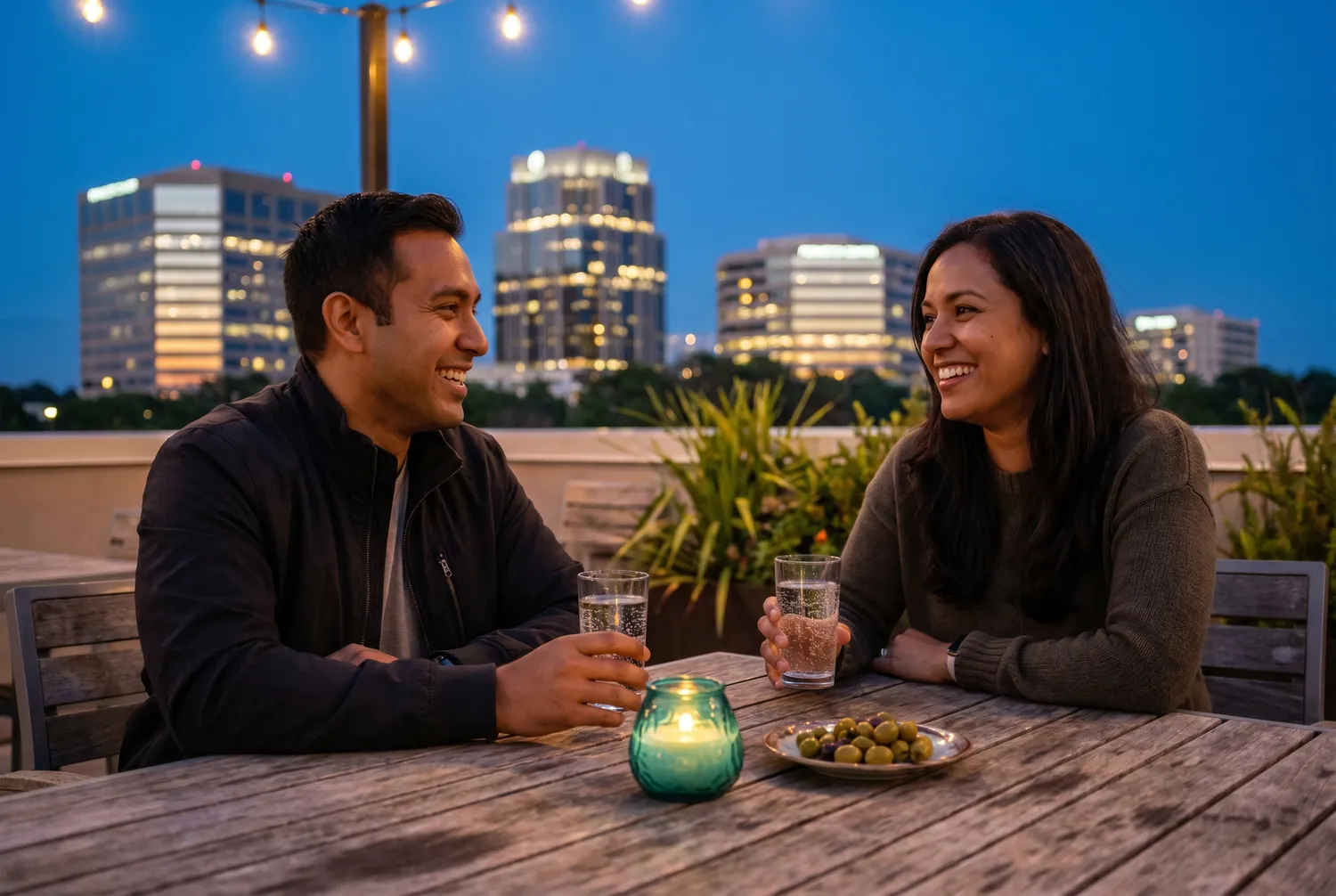 Rooftop conversation at dusk over the Sandy Springs Perimeter skyline